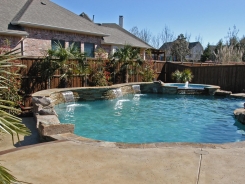 Free Form Pool and Spa with Ledger Stone Raised Bond Beam in Allen