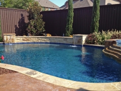 Free Form Pool with Spa and Raised Bond Beam in Frisco