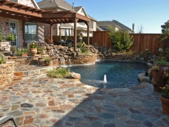 Stone Waterfalls with Flagstone Deck in Frisco