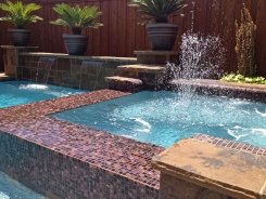 Glass Tile Spa with Aqua Blue Pebble Sheen in Plano