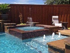 Glass Tile Spa with Bubblers and Aqua Blue Pebble Sheen in Plano