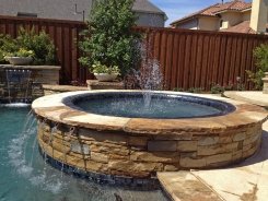 Iridescent Glass Tile Spa, Brass Spillways with Ocean Blue Pebble Sheen in Frisco