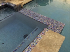 Iridescent Glass Tile Spa with Aqua Blue Pebble Sheen in Frisco