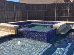 Tile Spillway on Spa with Ocean Blue Pebble Sheen in Allen