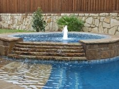 Tile on Spa with Tiered Spillway and Beach Entry in Frisco