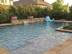 Geometric pool, Raised Bond Beam, Stone Water Bowls with Aqua Blue Pebble Sheen in Frisco