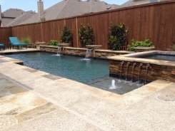 Geometric pool and Spa, Raised Bond Beam, with Ocean Blue Pebble Sheen in Frisco