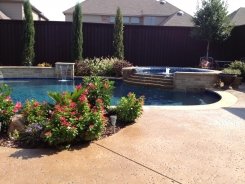 Iridescent Tile on Spa with Tiered Spillway and Sheer Descent in Frisco