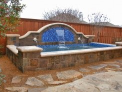 Raised Swim Spa with Water Features and Pebble Sheen in Plano