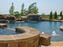 Stone Grotto and Waterfalls with Ocean Blue Pebble Sheen in Prosper