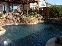 Stone Waterfalls with Flagstone Decking in Frisco